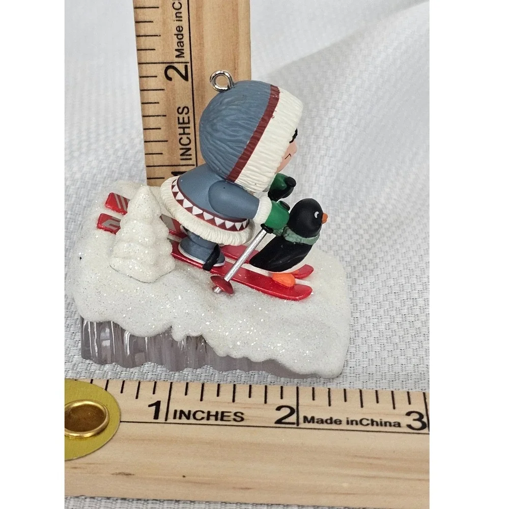 Hallmark Keepsake 2009 Eskimo and Penguin Skiing Christmas Ornament Winter Decor